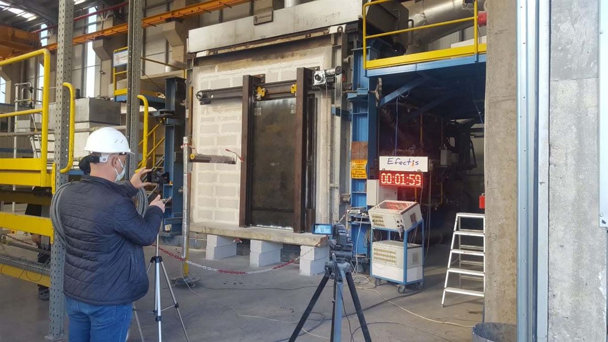 Blast door undergoing a fire resistance test in an accredited laboratory furnace with test timer running